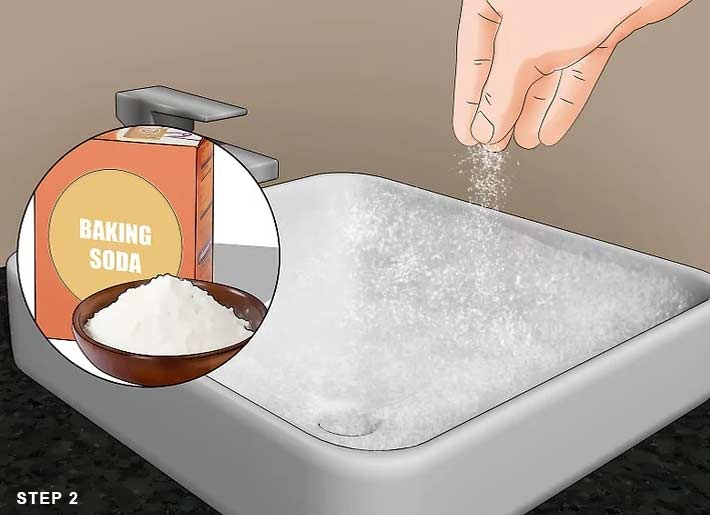 how to clean a bathroom sink ? step 2: Sprinkle baking soda into the sink