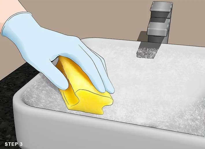 how to clean a wash basin ? step 2: Scrub the baking soda with a damp sponge 