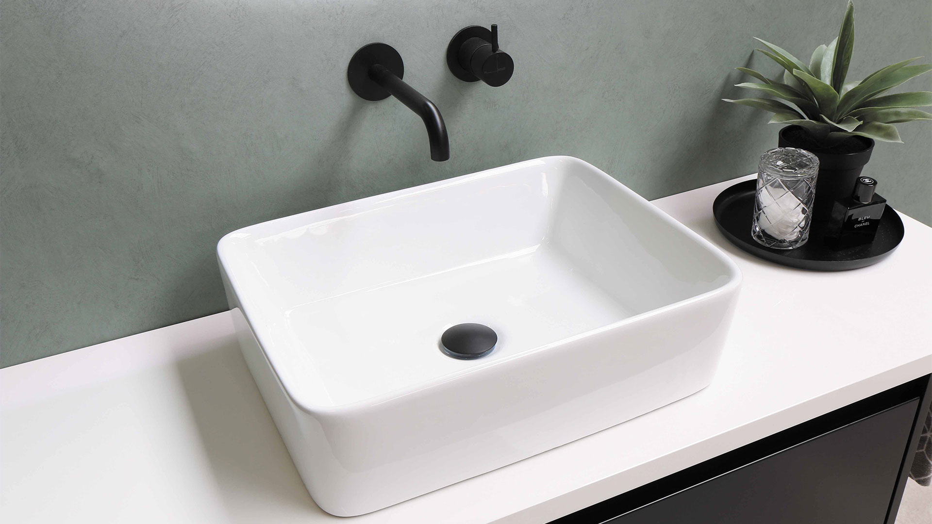 rectangle above counter wash basin with wall mounted faucet